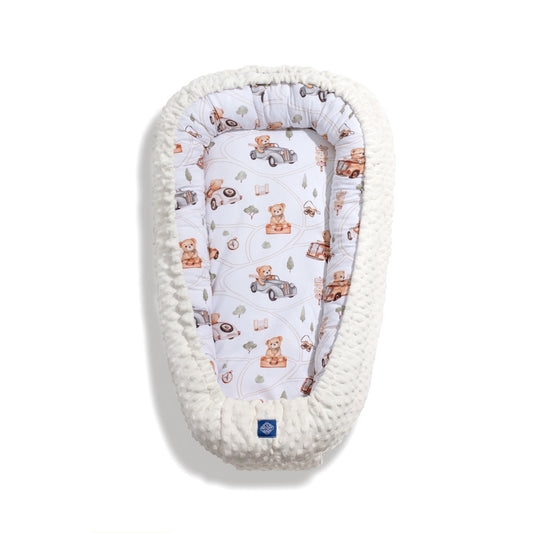 Baby cocoon nest with soft Minky border and comfortable mattress, perfect for newborns and infants