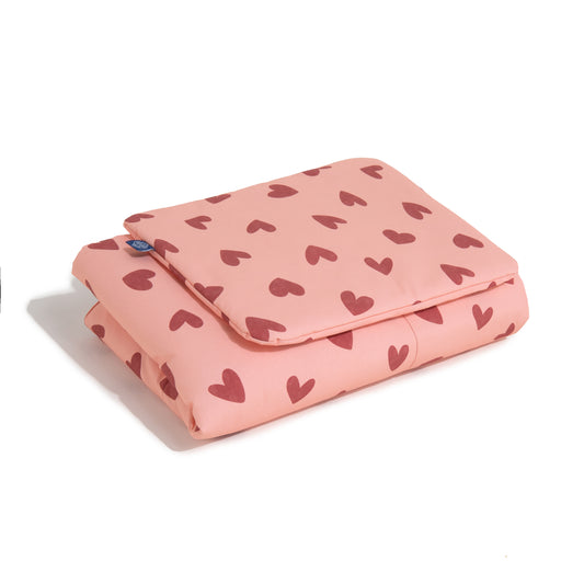 Pink bedding set with heart print, size, top view