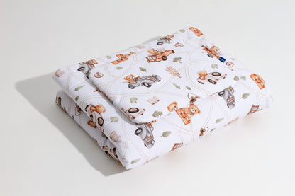 Baby bedding “Road Trip” with a design of teddy bears and cars, folded neatly, made from 100% cotton