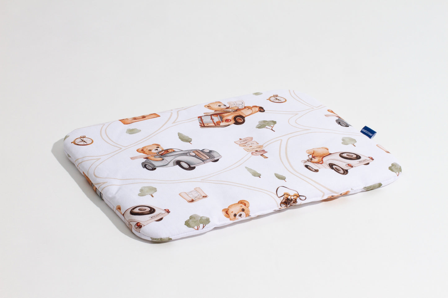 Baby pillow with a ‘Bear Adventures’ print, made of 100% cotton fabric, soft and hypoallergenic, angled side view