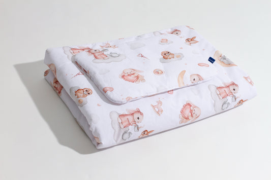 Baby bedding set Ready-to-Sleep with Moony Dream print, made from 100% cotton, featuring pastel bunnies and clouds, folded on a white surface