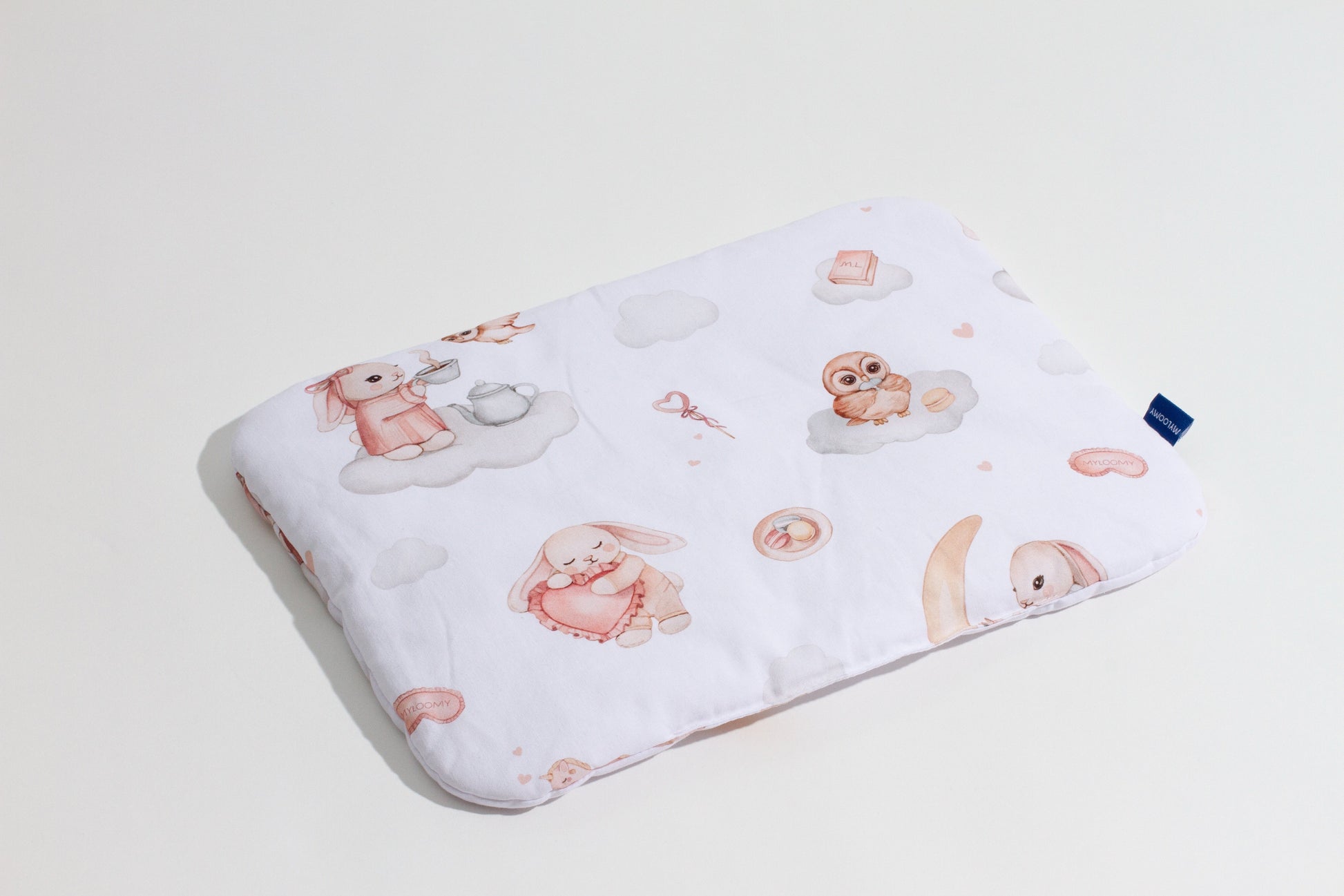 Baby pillow with Moony Dream print featuring bunnies, owls, and clouds, made of 100% cotton, perfect for infants. Top view