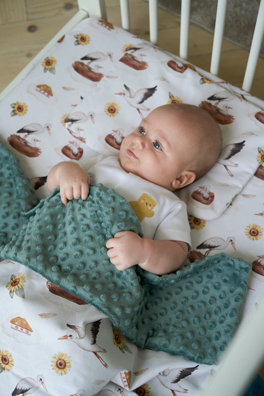 Baby blanket with sunflowers and storks print, soft green backing, My Ukraine collection