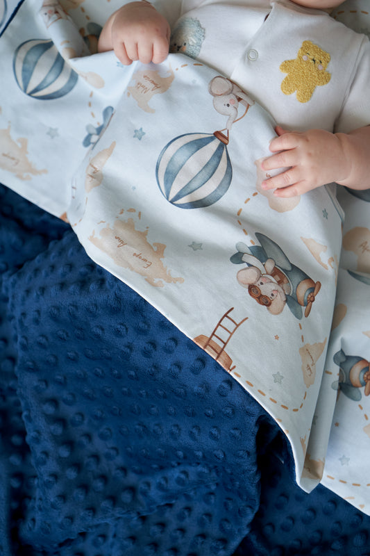 Top view of baby blanket with hot air balloons and bear print, blue and white design, Sky Dreamer collection